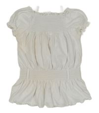 Bílá tunika se žabičkováním