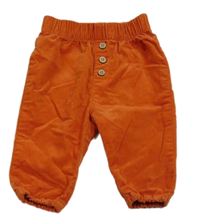 Oranžové manšestráky s knoflíky 