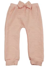 Meruňkové vzorované tepláky s mašlí 