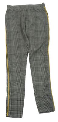 Černo-bílo-žluté kostkované legíny s pruhy H&M
