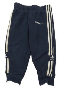 Tmavomodré tepláky s logem Adidas