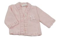 Světlerůžový puntíkatý propínací svetr s mašlemi