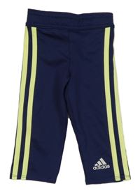Tmavomodro-žluté pruhované sportovní legíny Adidas