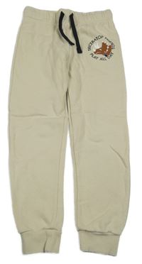 Béžové tepláky s dinosaurem H&M