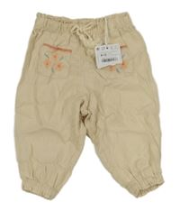 Nové - Béžové lněné kalhoty s kapsami s výšivkami květin Sfera