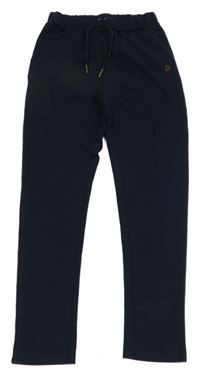 Tmavomodré tepláky Pomp Lux