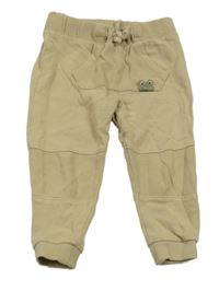 Béžové tepláky s žabkou C&A