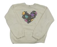 Bílý svetr se srdíčkem z překlápěcích flitrů H&M