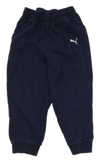 Tmavomodré tepláky s logem Puma