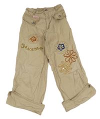 Béžové plátěné crop kalhoty s kapsami s květy 