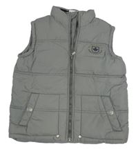 Šedá šusťáková zateplená vesta s nášivkou zn. Pocopiano