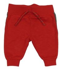 Červené tepláky s pruhem Primark