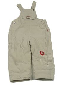 Béžové šusťákové zateplené laclové kalhoty s pejskem a nápisem Kanz