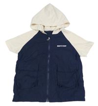 Tmavomodro-smetanová šusťáková vesta s nápisem a kapucí 