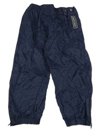 Tmavomodré šusťákové voděodolné kalhoty 