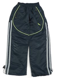 Tmavomodré šusťákové podšité kalhoty Adidas