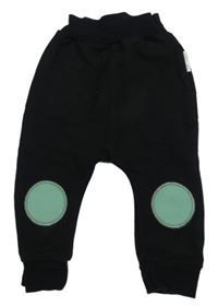 Černo-zelené tepláky s kruhy