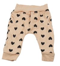 Světlerůžové baggy tepláky se srdíčky 