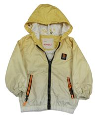 Smetanovo-žlutá šusťáková jarní bunda s kapucí Bombili