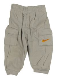Béžové cargo tepláky s kapsami Nike 