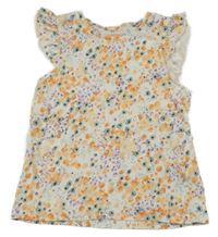 Smetanové tričko s kytičkami a volánky lupilu