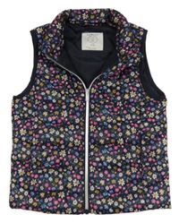 Tmavomodrá květovaná šusťáková zateplená vesta Primark