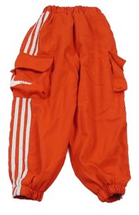 Červené šusťákové zateplené cargo kalhoty Nike