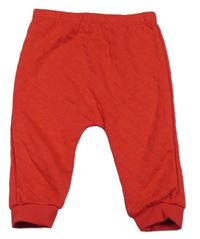 Červené prošívané tepláky