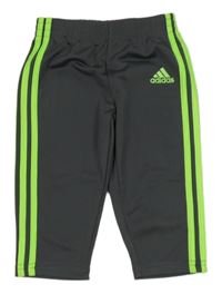 Tmavošedé sportovní tepláky se zelenými pruhy a logem - Adidas 