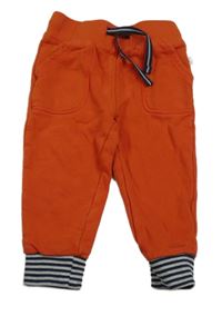 ORanžovo-pruhované tepláky Liegelind