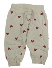 Světlebéžové tepláky se srdíčky H&M