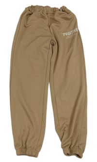 Béžové sportovní kalhoty s nápisem