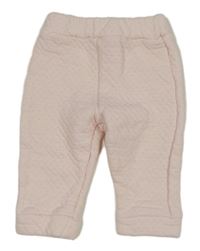 Světlerůžové vzorované vyteplené tepláky 