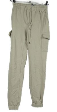 Dámské béžové cargo tepláky s kapsami Amisu vel. 32