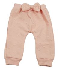 Světlerůžové tepláky se srdíčky a mašlí 