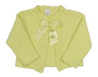 Žlutý svetr s mašlí