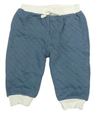 Modrošedé prošívané tepláky