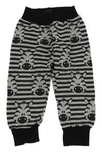 Černo-šedé pruhované tepláky se zebrami