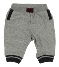 Šedé melírované tepláky s tmavomodrým lemem 