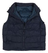 Tmavomodrá šusťáková zateplená vesta UNIQLO