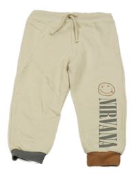 Světlebéžovo-hnědo-tmavošedé tepláky smajlíkem a nápisem - NIRVANA