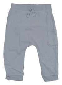 Modré tepláky s kapsou Tu