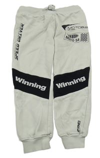 Světlešedo-černé tepláky s nápisy H&M