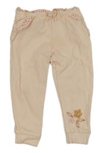 Broskvové tepláky s volánky Mothercare
