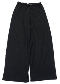 Černé mačkané široké kalhoty H&M