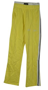 Dámské žluté tepláky s pruhy Palm Angels