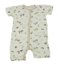 Bílo-béžový kraťasový overal s koly 