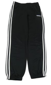 Černé sportovní tepláky s pruhy a logem Adidas