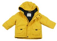 Tmavožlutá šusťáková zimní bunda s kapucí PRIMARK