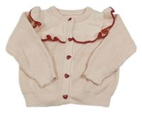 Světlerůžovo-červený propínací svetr s volánkem a srdíčky 